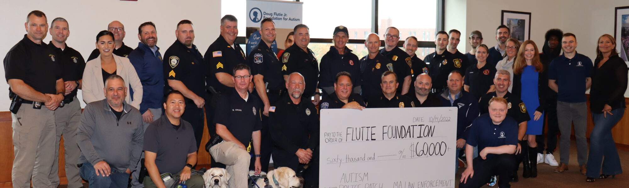 Cops with flutie foundation donation check