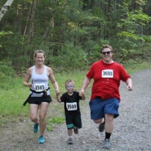 Parents running with their son